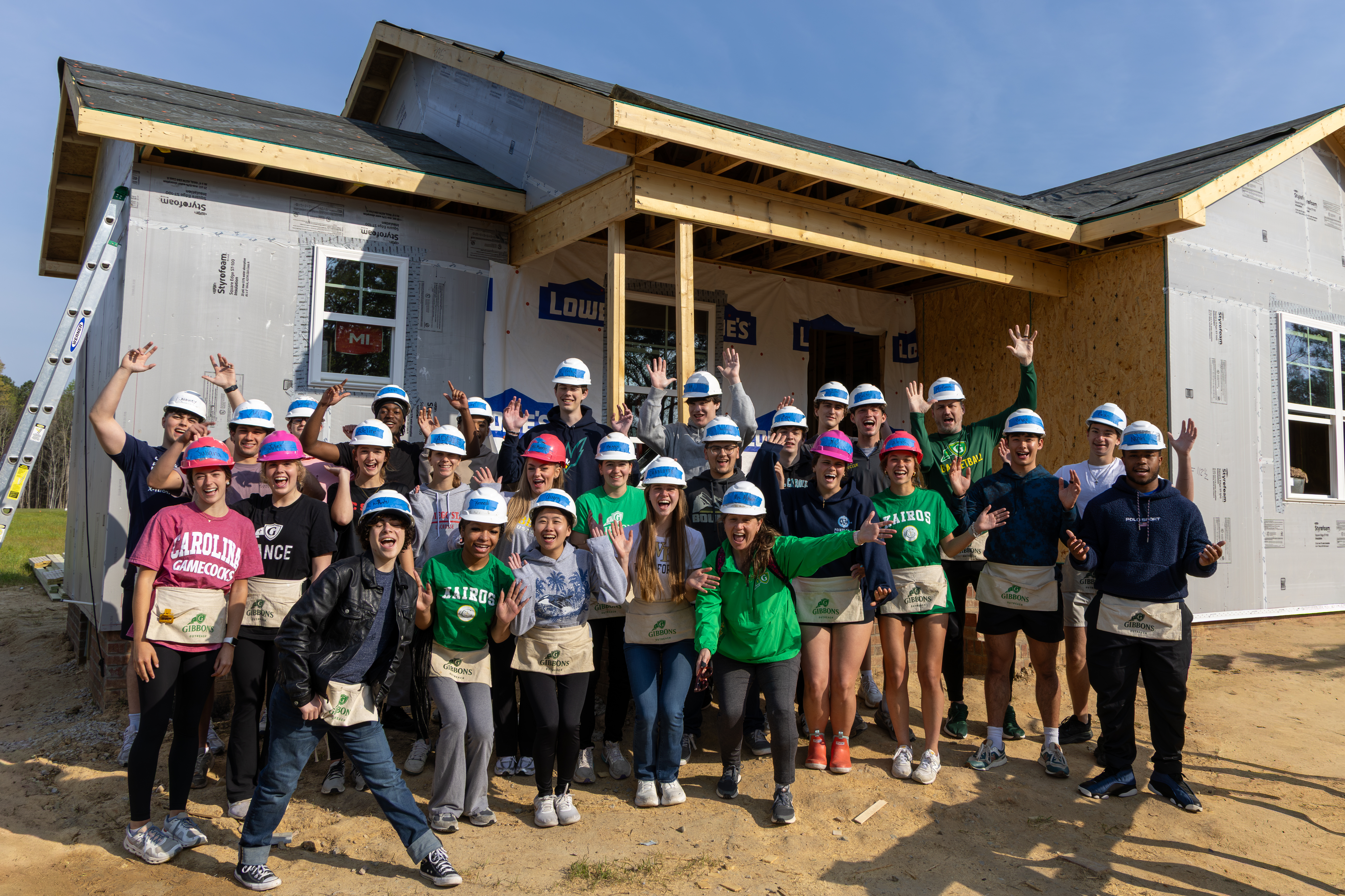 Group photo of cardinal gibbons students on the Habitat Build site