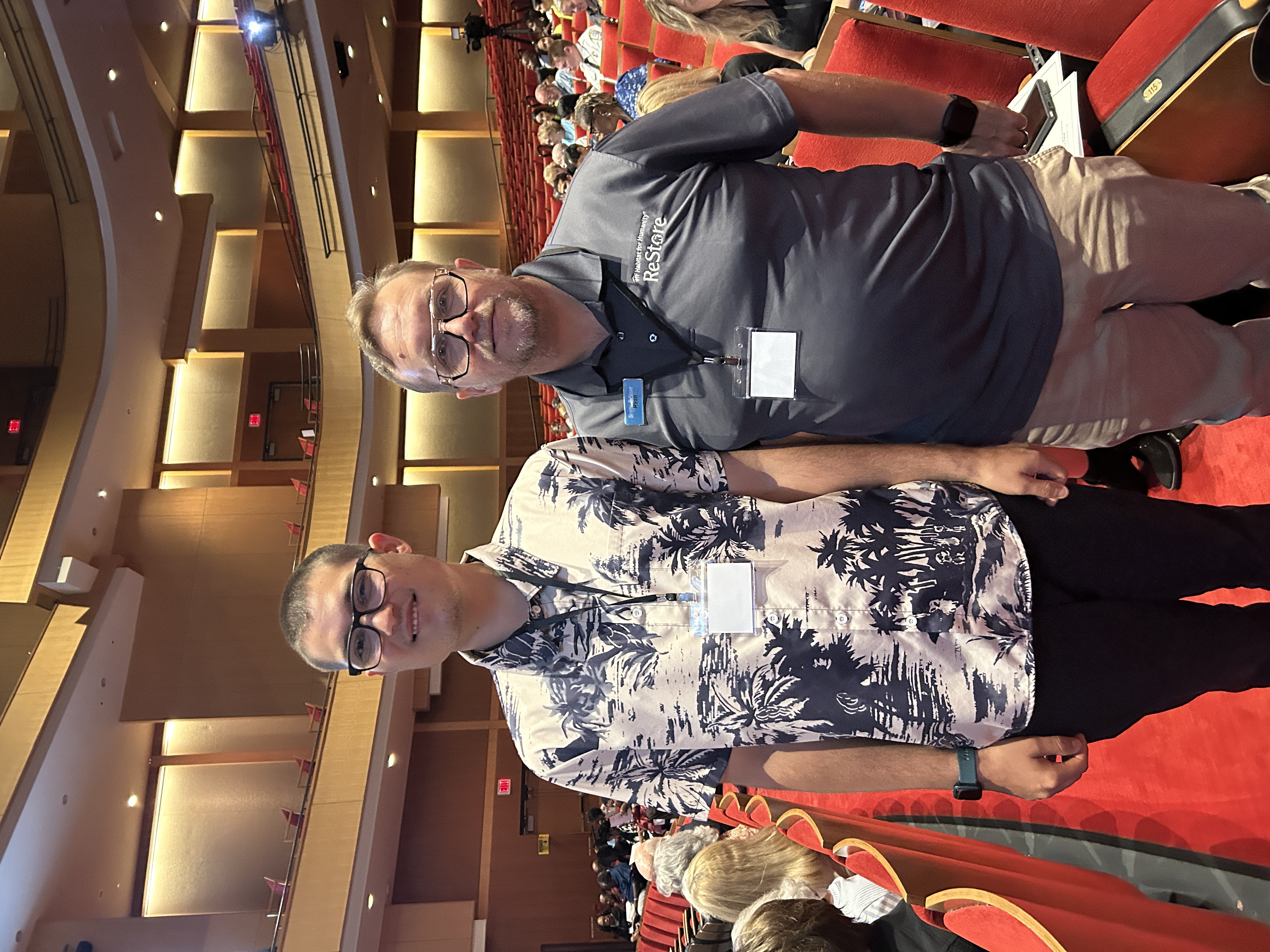 Volunteer Kai Christopher with Clayton ReStore Manager Ryan Stein