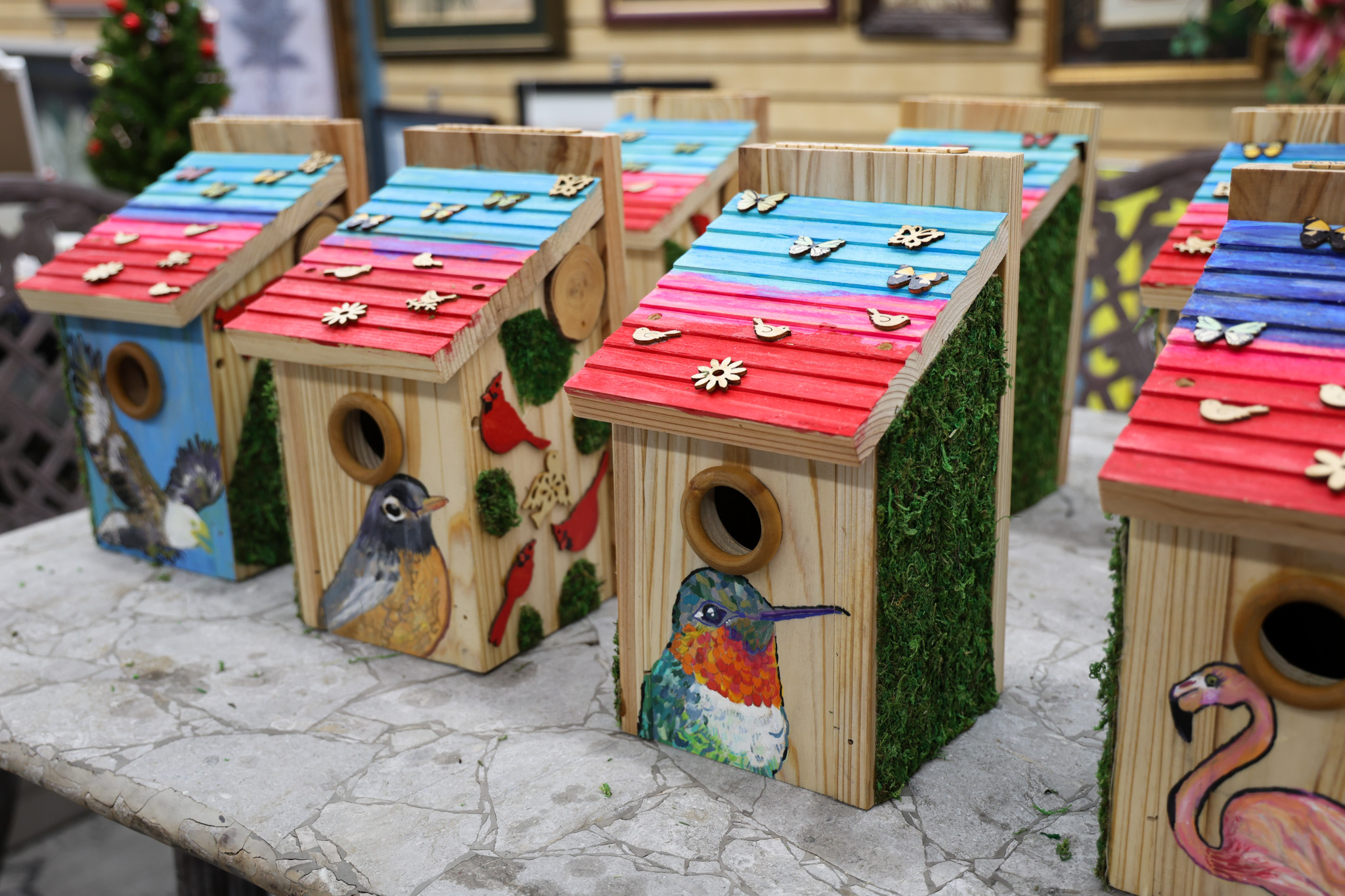 close up photo of birdhouses built by naveen representing climate change