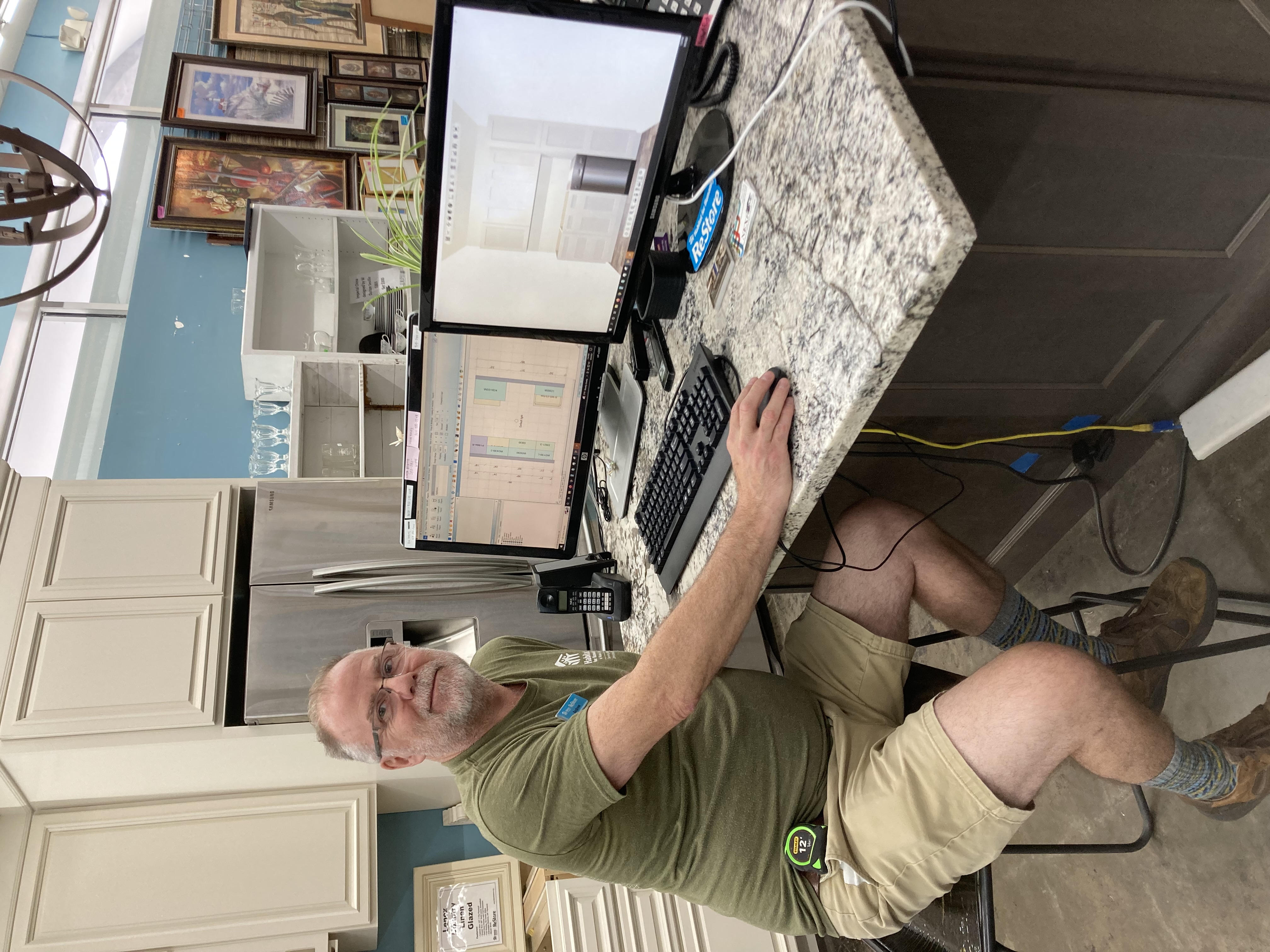 Andrew at his cabinet workstation at the Cary ReStore showroom