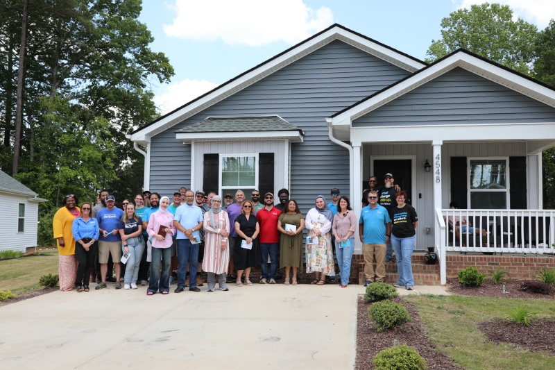 Group of supporters at ReStore Round-Up Dedication