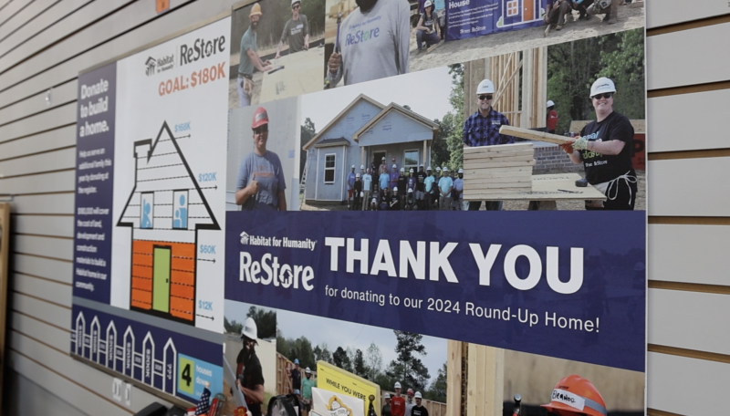 ReStore Round-Up thank you and fundraising tracking poster inside Wake Forest ReStore